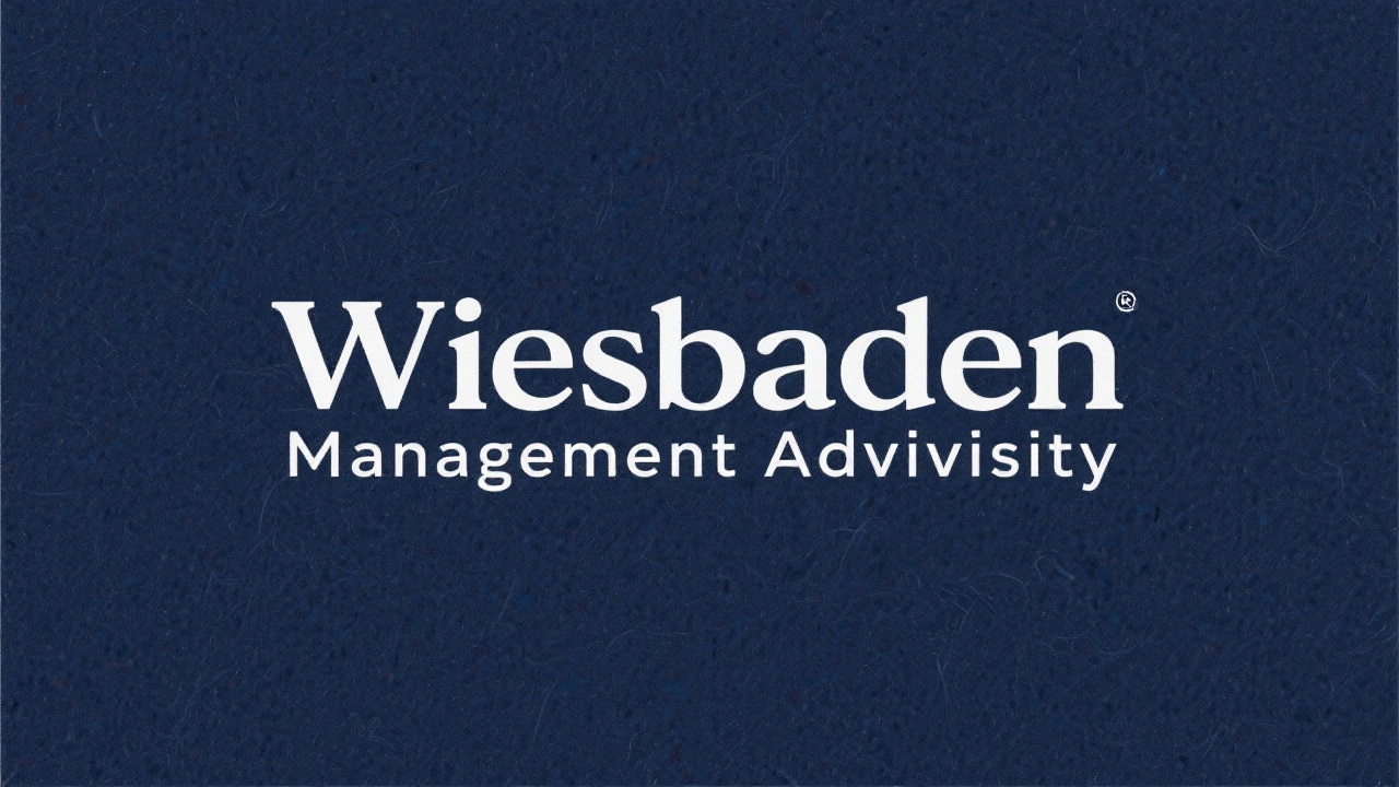 Simple navy typography logo stating Wiesbaden Management Advisory without graphical elements